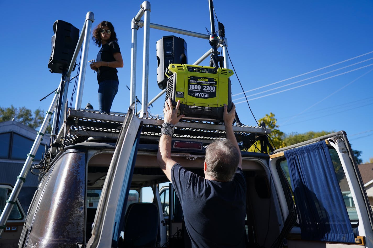 Carly Beseman was on the roof stage as Stuart DeVann lifted a generator.