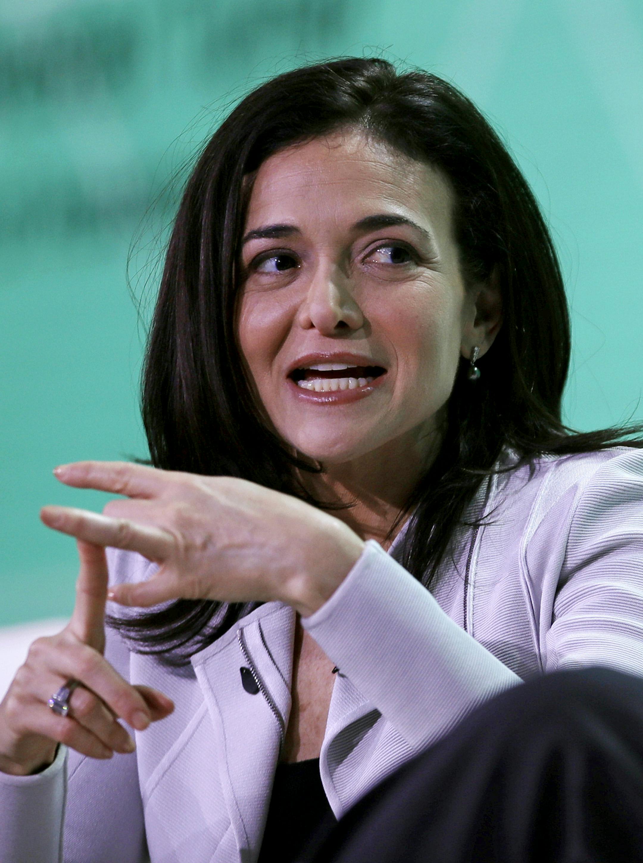 Facebook Chief Executive Officer Sheryl Sandberg gestures as she addresses guests during the annual meeting of the U.S. Conference of Mayors in Boston, Friday, June 8, 2018. More than 250 city executives gathered to discuss their concerns including infrastructure, school safety, immigration and the economic future of cities. (AP Photo/Charles Krupa) ORG XMIT: MACK117