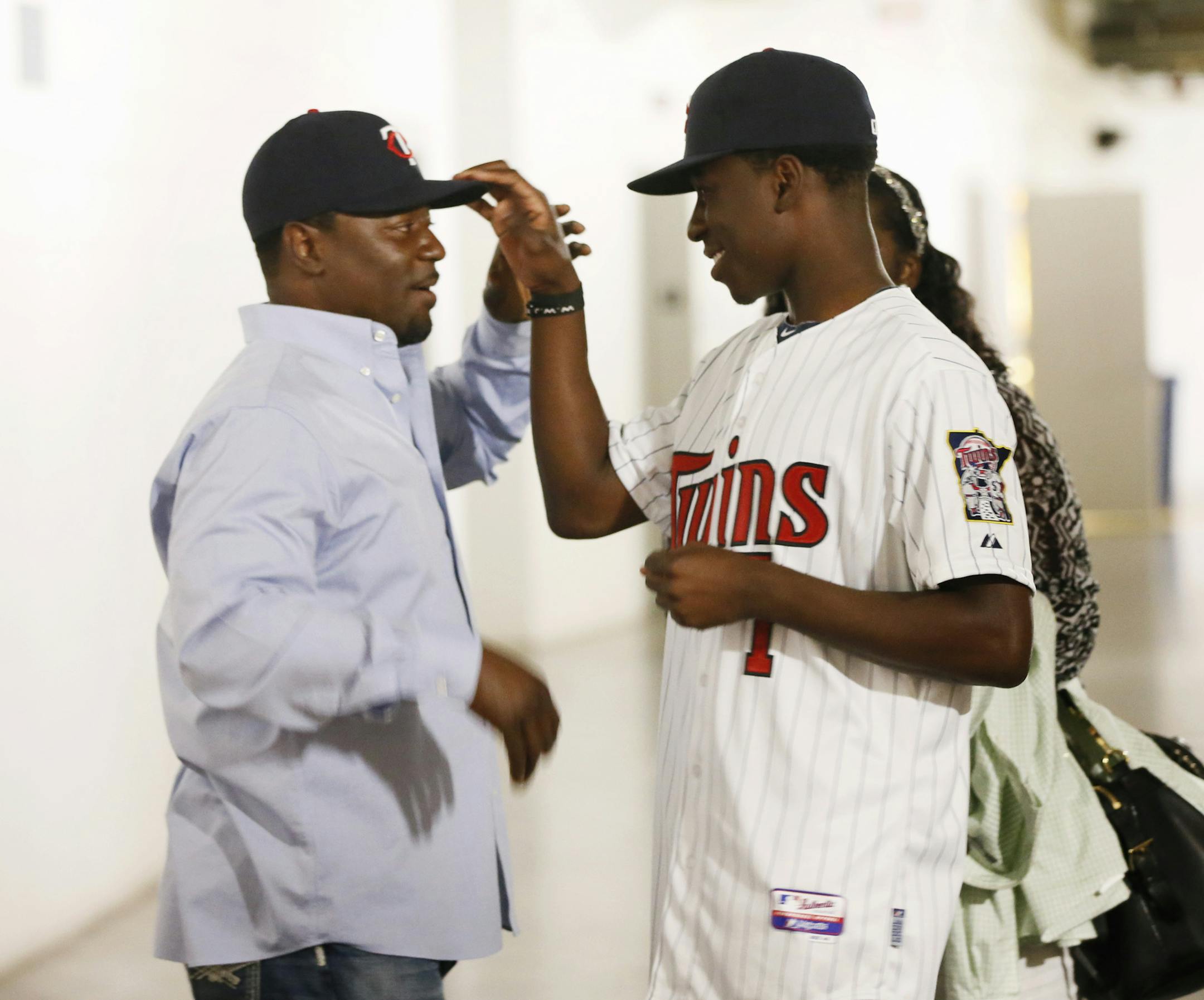 Nick Gordon right tipped his father Tom "Flash" Gordon hat before he was introduced to the Twin Cities media. Twins sign shortstop Nick Gordon from Olympia High school in Orlando, Fla. whom they selected with the 5th overall pick in the 2014 Major League Baseball First-year Player draft. The 18-year-old Gordon spoke with media Monday at Target Field June 9, 2014 in Minneapolis ,MN. ] Jerry Holt Jerry.holt@startribune.com ORG XMIT: MIN1406091652191968