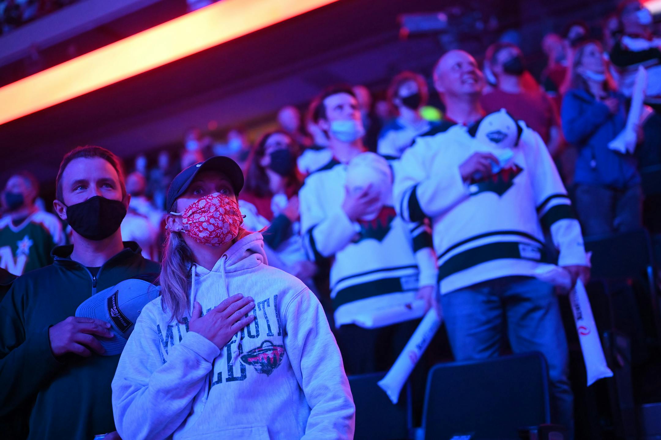 Minnesota Wild fans stand for the national anthem.