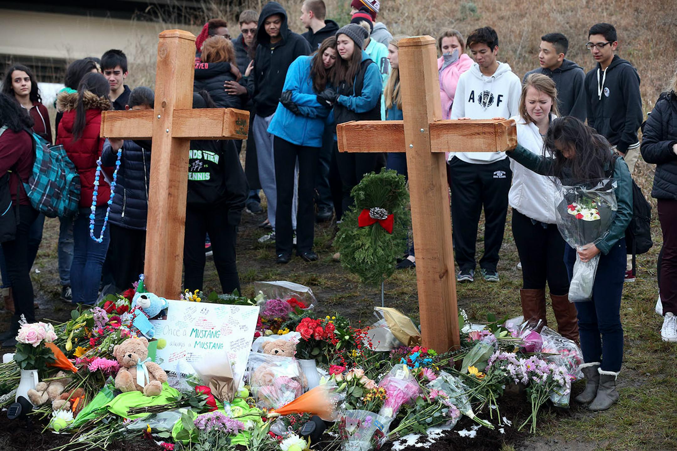 Students from Mounds View High school gathered at the crash scene along Hwy. 96 where they left memorials for two students who were killed in a crash December 05, 2016.