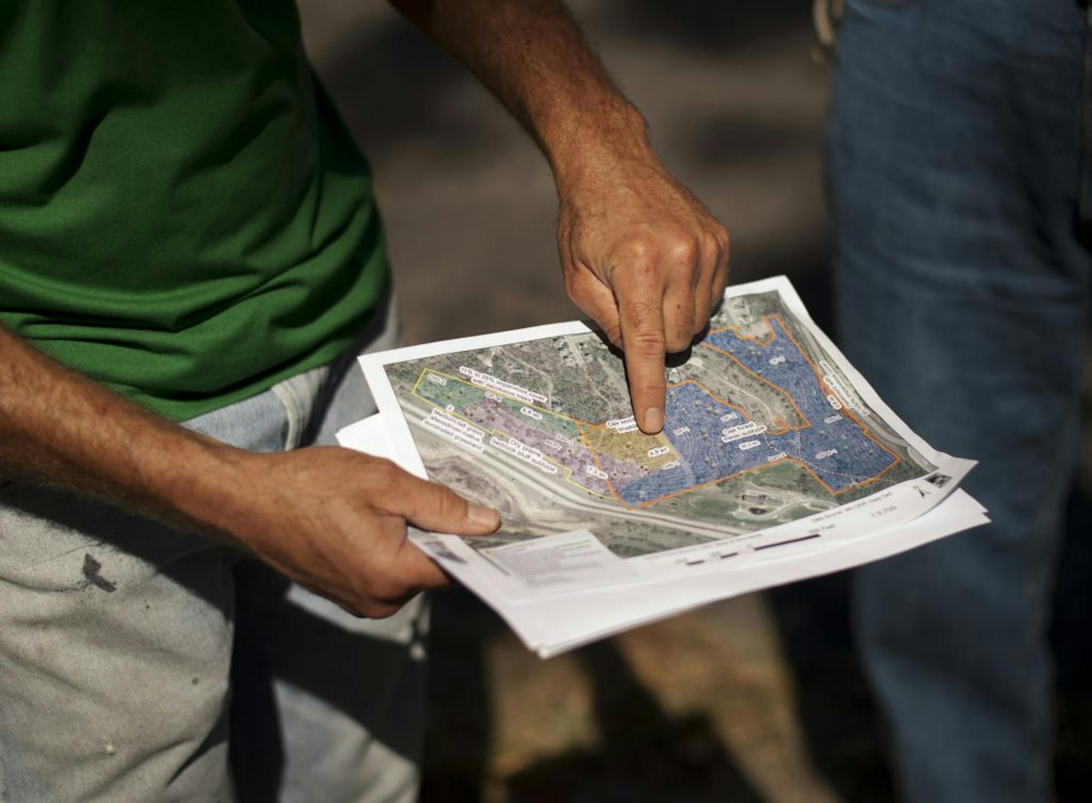 Joe Walton, an ecologist with Friends of the Mississippi River showed volunteers the aea they would be working on. Volunteers helped remove buckthorn and other invasive species that have overgrown the Gateway North Open Space area, a 54-acre natural area in Cottage Grove.