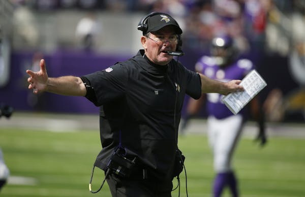 Minnesota Vikings head coach Mike Zimmer reacts to a call during the second half of an NFL football game against the San Francisco 49ers, Sunday, Sept