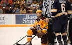 Minnesota Golden Gophers forward Leon Bristedt (18) looked on in frustration after being called for goalkeeping interference in the first period again