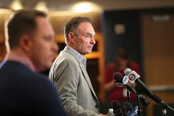 Twins baseball boss Derek Falvey, left, looked on as manager Paul Molitor spoke during an October news conference. Molitor was named AL Manager of the