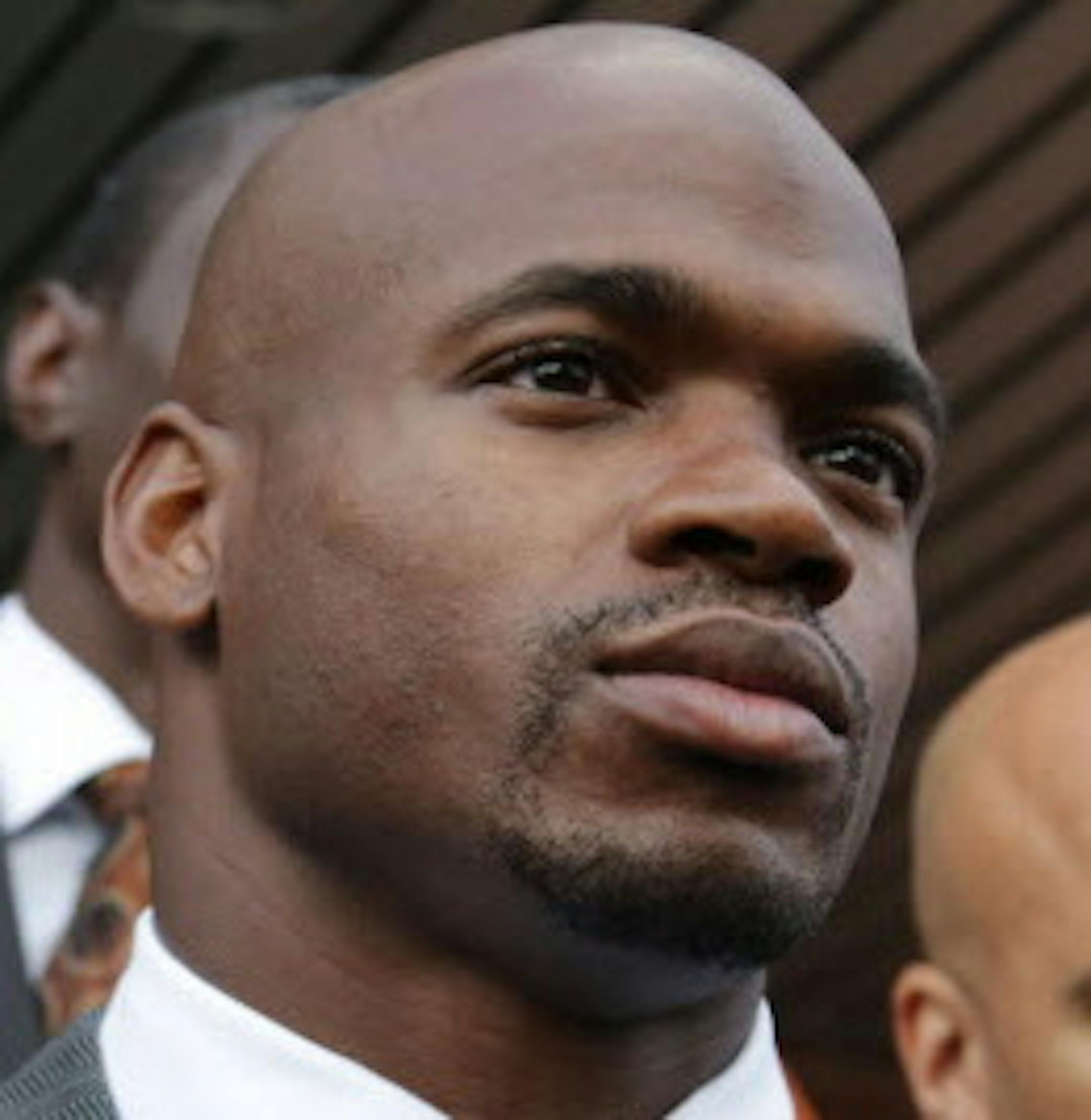 Minnesota Vikings running back Adrian Peterson leaves court accompanied by his wife, Ashley Brown Peterson, in Conroe, Texas, Wednesday, Oct. 8, 2014. A judge tentatively set a Dec. 1 trial date for Peterson on a charge of felony child abuse for using a wooden switch to discipline his 4-year-old son earlier this year. (AP Photo/Houston Chronicle, Billy Smith II)