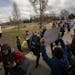 Students, parents and supporters made a tunnel of support for faculty as they entered the school on Thursday, April 18, 2018 outside of Ramsey Element