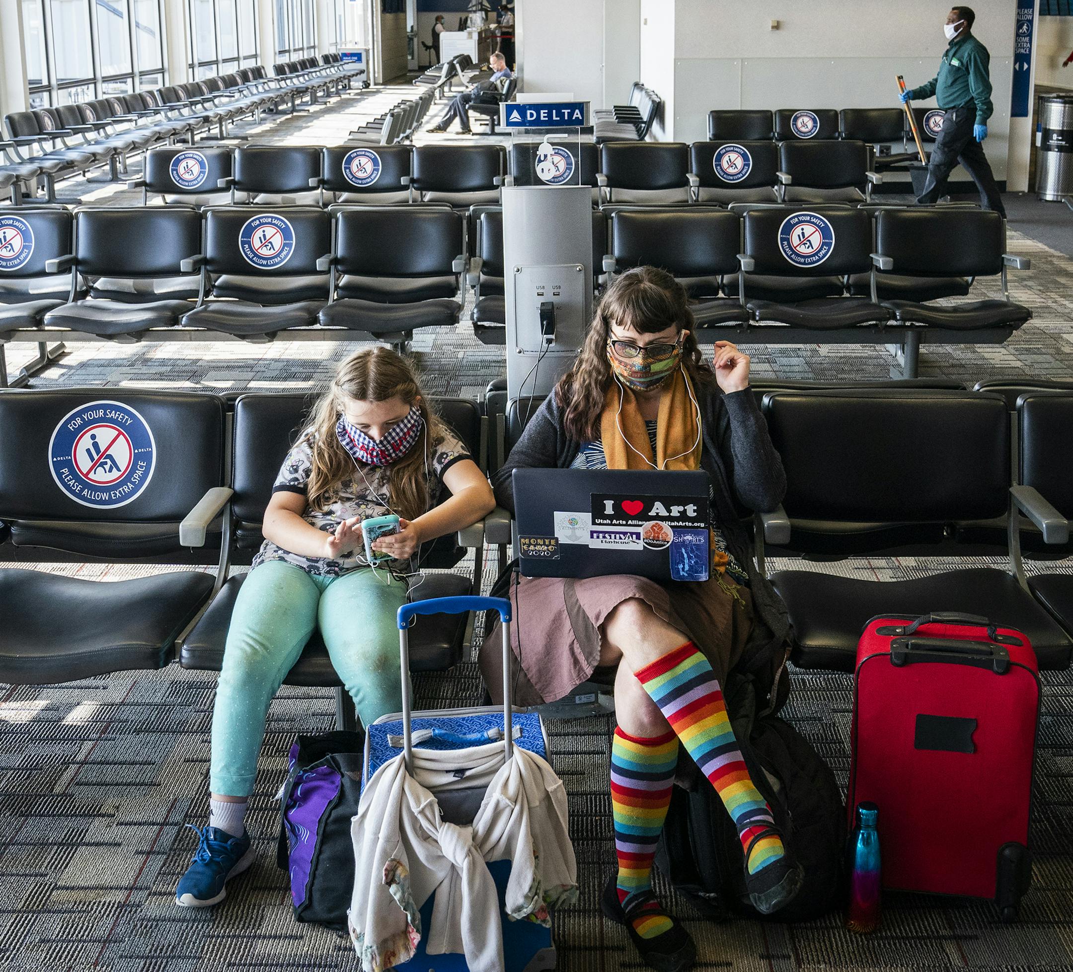 Mary Emma Heaps of Kalamazoo, Michigan waited for a flight with her daughter Mercy, 8, in Terminal 1 of Minneapolis - St. Paul International Airport. ] LEILA NAVIDI • leila.navidi@startribune.com BACKGROUND INFORMATION: Terminal 1 of Minneapolis - St. Paul International Airport on Wednesday, September 23, 2020. The pandemic and economic crisis could bring lasting changes to the Minneapolis-St. Paul International Airport, underscoring the airport's outsized role as an economic engine in the Upper