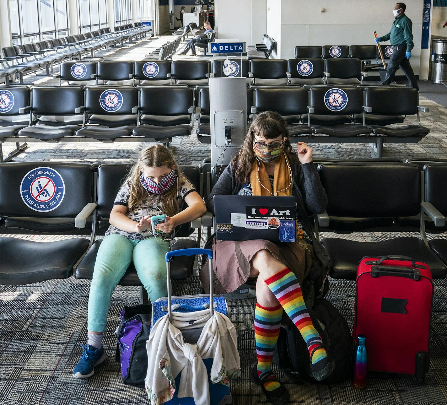 Mary Emma Heaps of Kalamazoo, Michigan waited for a flight with her daughter Mercy, 8, in Terminal 1 of Minneapolis - St. Paul International Airport. ] LEILA NAVIDI • leila.navidi@startribune.com BACKGROUND INFORMATION: Terminal 1 of Minneapolis - St. Paul International Airport on Wednesday, September 23, 2020. The pandemic and economic crisis could bring lasting changes to the Minneapolis-St. Paul International Airport, underscoring the airport's outsized role as an economic engine in the Upper