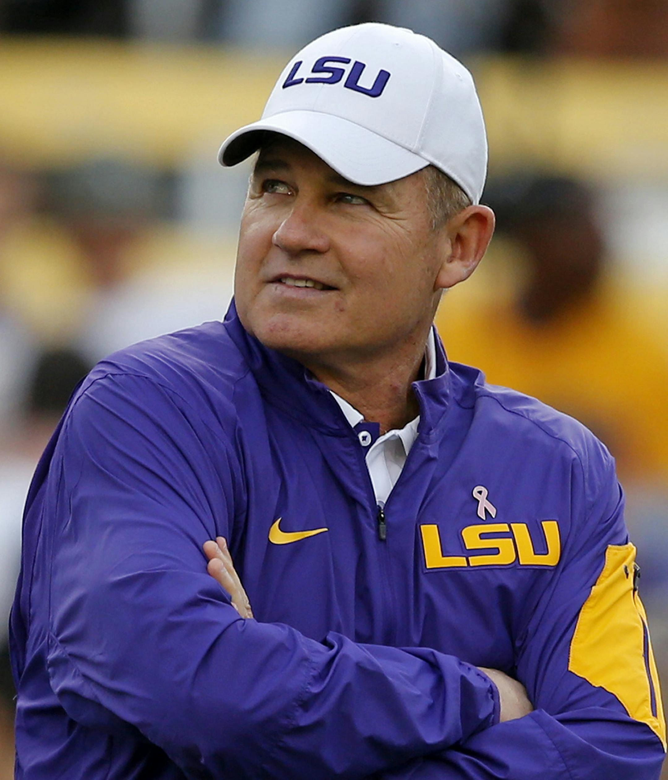 FILE - In this Oct. 17, 2015, file photo, LSU coach Les Miles watches his team warm up before an NCAA college football game against Florida in Baton Rouge, La. That Les Miles could be even considered to be on the dreaded hot seat at LSU entering this season tells you all you need to know about job security among college football coaches these days _ especially those in the Southeastern Conference. (AP Photo/Gerald Herbert, File) ORG XMIT: NY158