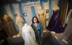 Lynne Rickert stood next to her wedding dress from 1970 that is part of an exhibit of historical wedding dresses at the Anoka County Historical Societ