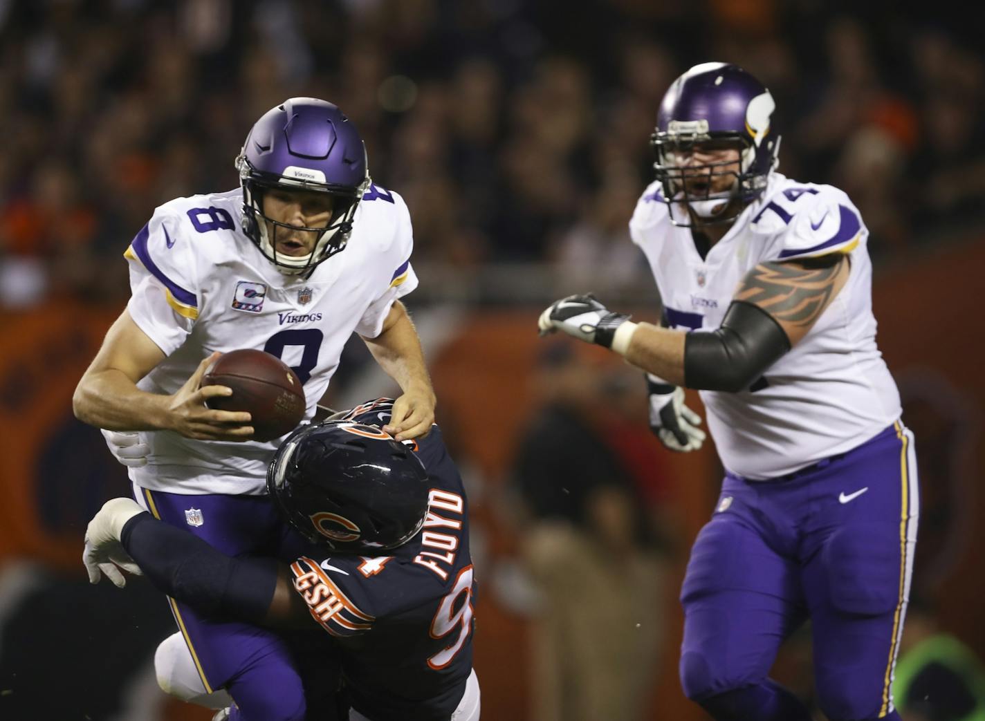 Vikings quarterback Sam Bradford (8) was sacked in the end zone by Chicago Bears outside linebacker Leonard Floyd (94) for a safety in the first quarter.