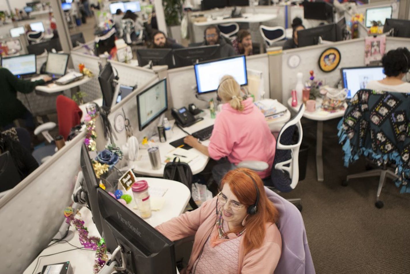 Photo by J. Kat Woronowicz for the Star Tribune/Operator Service Representative Toni Watson, center, takes calls at the Great Call Service Center in Carlsbad, Calif.