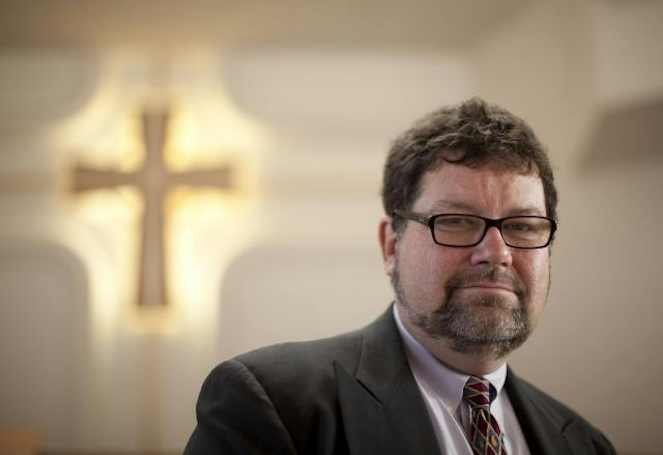 Erwin Barron awaited the decision of the Presbytery of the Twin Cities Area in the sanctuary of Oak Grove Presbyterian Church in Bloomington on Monday. The panel split 3-3 and may appeal.
