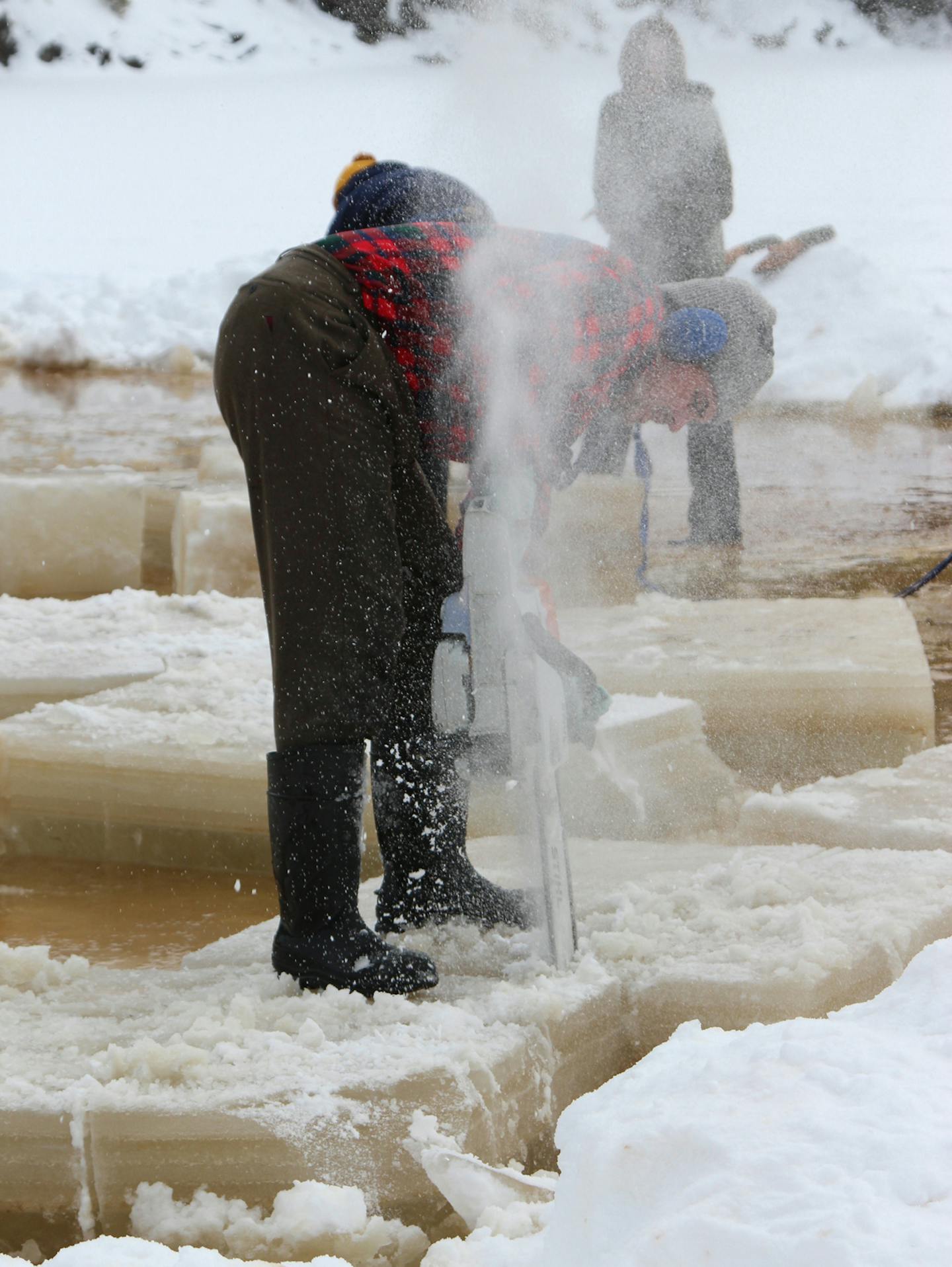 Scoring ice into smaller blocks at the Ice Ball.