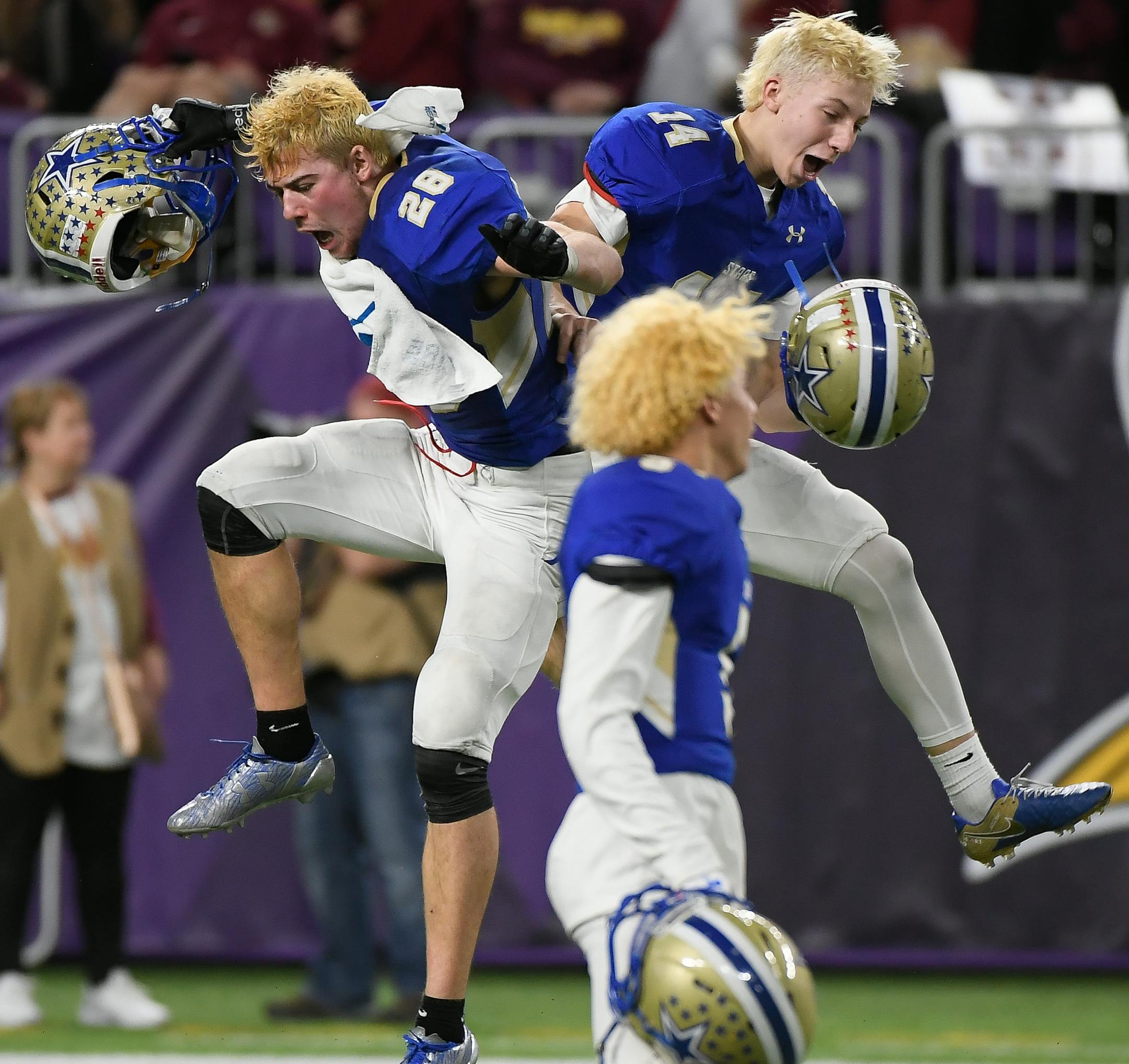 Holy Angels defensive end Alex Gillard (28) and wide receiver Andrew Rukavina (14) celebrated their team's 26-22 victory over Winona. ] AARON LAVINSKY ï aaron.lavinsky@startribune.com Holy Angels played Winona in a Class 4A state tournament semifinal game on Thursday, Nov. 16, 2017 at US Bank Stadium in Minneapolis, Minn.