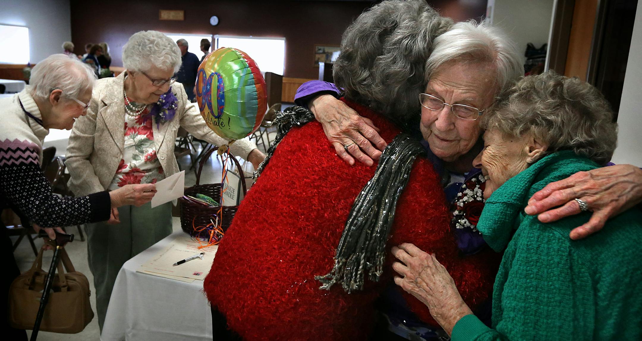 Shirley Walsh (right, center) and Betty Stranberg (2nd from left) greeted friends and family at a birthday party held in honor of each of their 90th birthdays at the Atwater Community Center. ] JIM GEHRZ ‚Ä¢ jgehrz@startribune.com / Minneapolis, MN / February 15, 2014 / 12:00 PM / BACKGROUND INFORMATION: FOR DUETS COLUMN-- Betty Stranberg and Shirley Walsh have been back-door neighbors in Atwater, Minnesota, for many years. They will celebrate their 180th birthday (90 plus 90) o