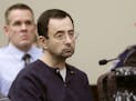 FILE - In this Jan. 24, 2018, file photo, Larry Nassar sits during his sentencing hearing in Lansing, Mich. The Michigan attorney general's office is 