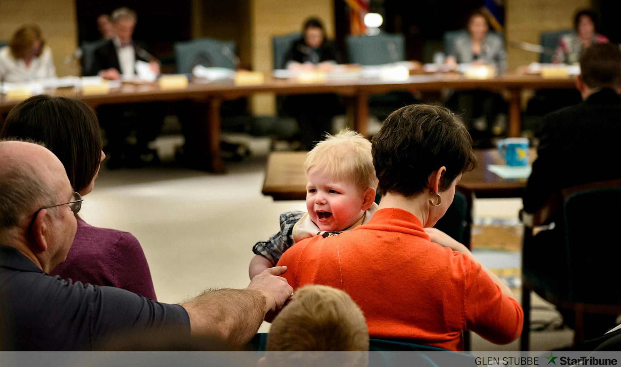 Wyatt Hauser's grandpa Neal Hutzler tried to comfort him as his mom Jessica Hauser prepared to testify before the committee.  Wyatt was born with a severe form of epilipsy called infantile spasms.  After trying many medical treatments that were ineffective or had severe side effects, Doctors recommended a chemical extracted from marijuana which is effective in treating Wyatt's illness and is currently illegal in Minnesota.   The Minnesota Senate Committee on Health, Human Services and Housing held a public hearing  on a bill that would provide legal access to medical marijuana for people with specific debilitating medical conditions.  The hearing was held at the Minnesota State Capitol, St. Paul, MN.      ]   GLEN STUBBE * gstubbe@startribune.com   Thursday, April 10, 2014
