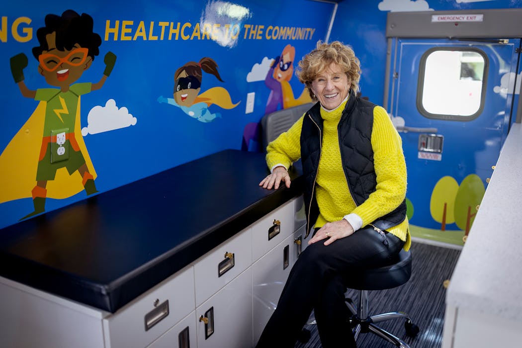 Dr. Dawn Martin in Hennepin Healthcare’s new mobile pediatric van. Martin, who is retiring this year, was instrumental in getting the van operating to provide access to medical care for children.