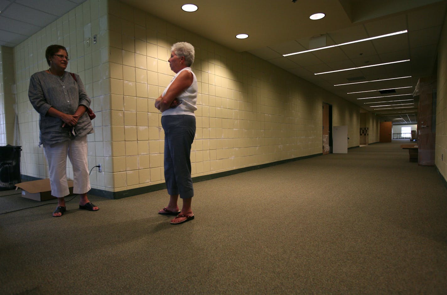 This fall the halls of Redtail Ridge Elementary School will echo with the footsteps of a lonely custodian — voters in the Prior Lake-Savage district refused to approve operating funds. Superintendent Sue Ann Gruver, left, viewed the brand-new school with Pam Becker, who would have been its principal.