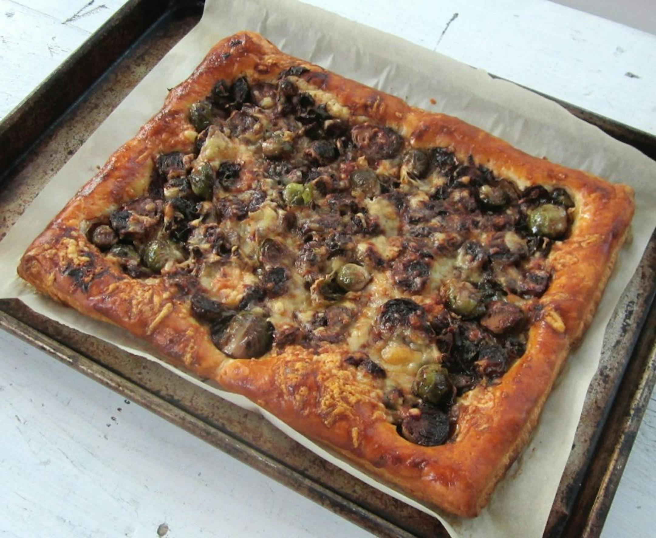 Browning Brussels sprouts briefly before baking them on puff pastry tempers their characteristic bitterness.