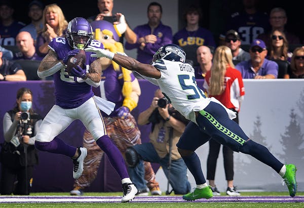 In raucous home opener, Cousins and Vikings dominate Seattle
