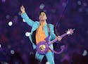 FILE - In this Feb. 4, 2007, file photo, Prince performs during the halftime show at the Super Bowl XLI football game at Dolphin Stadium in Miami. The