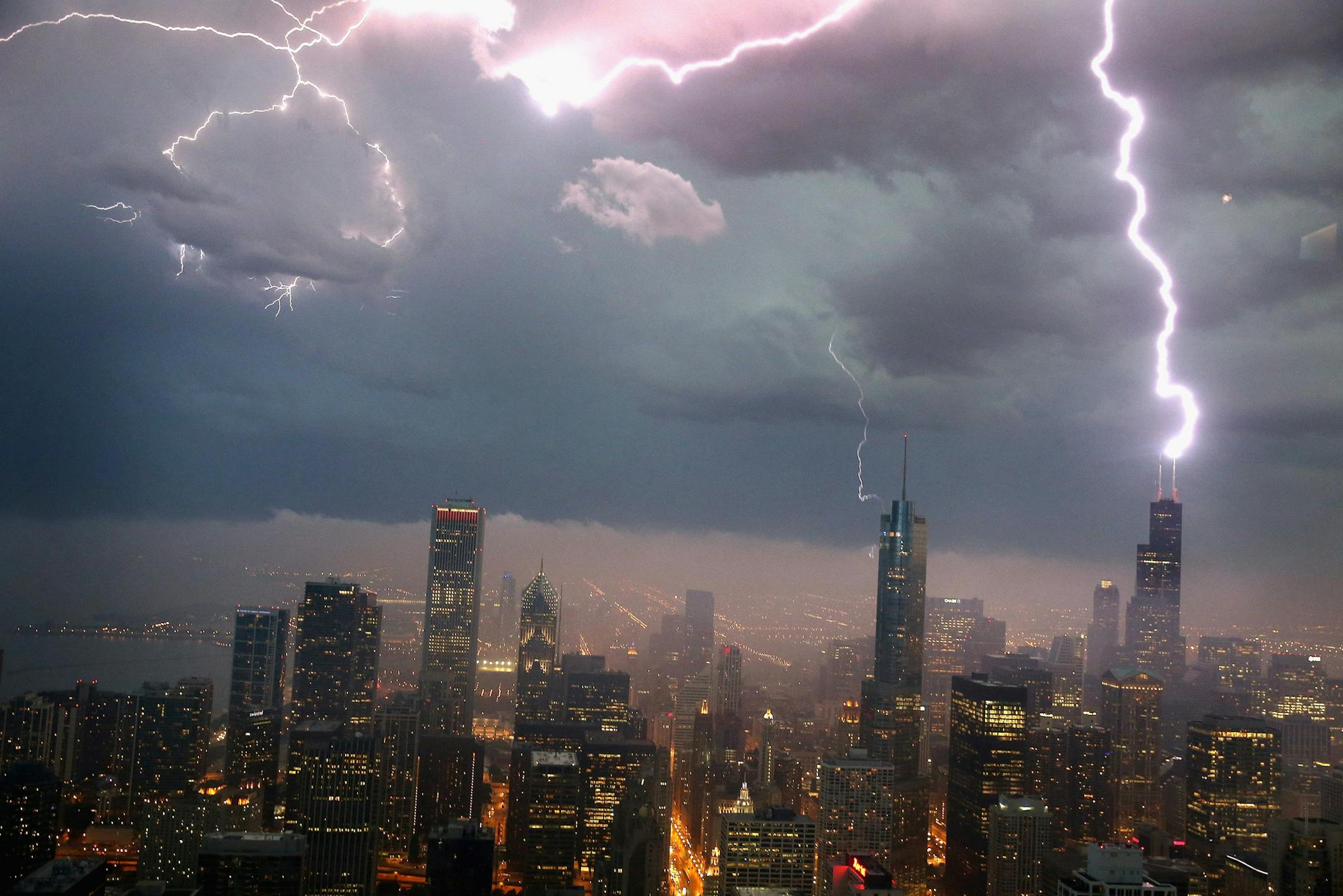 CHICAGO, IL - JUNE 12: Lightning strikes the Willis Tower (formerly Sears Tower) in downtown on June 12, 2013 in Chicago, Illinois. A massive storm system with heavy rain, high winds, hail and possible tornadoes is expected to move into Illinois and much of the central part of the Midwest today. (Photo by Scott Olson/Getty Images) ORG XMIT: 170596470