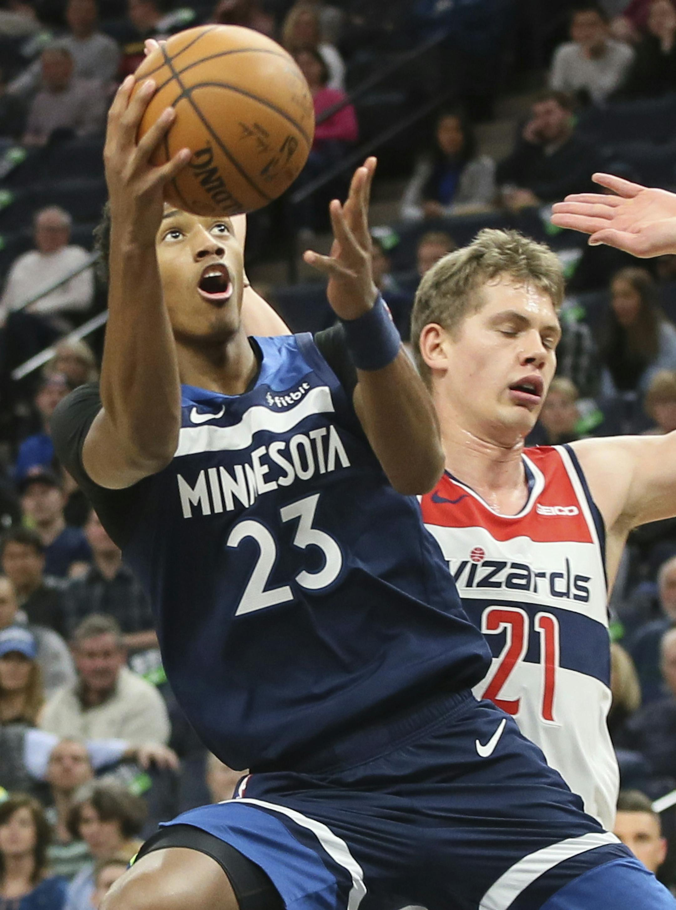 Minnesota Timberwolves' Jarrett Culver, left, shoots past Washington Wizards' Moritz Wagner, of Germany, in the first half of an NBA basketball game Friday, Nov 15, 2019, in Minneapolis. (AP Photo/Jim Mone)