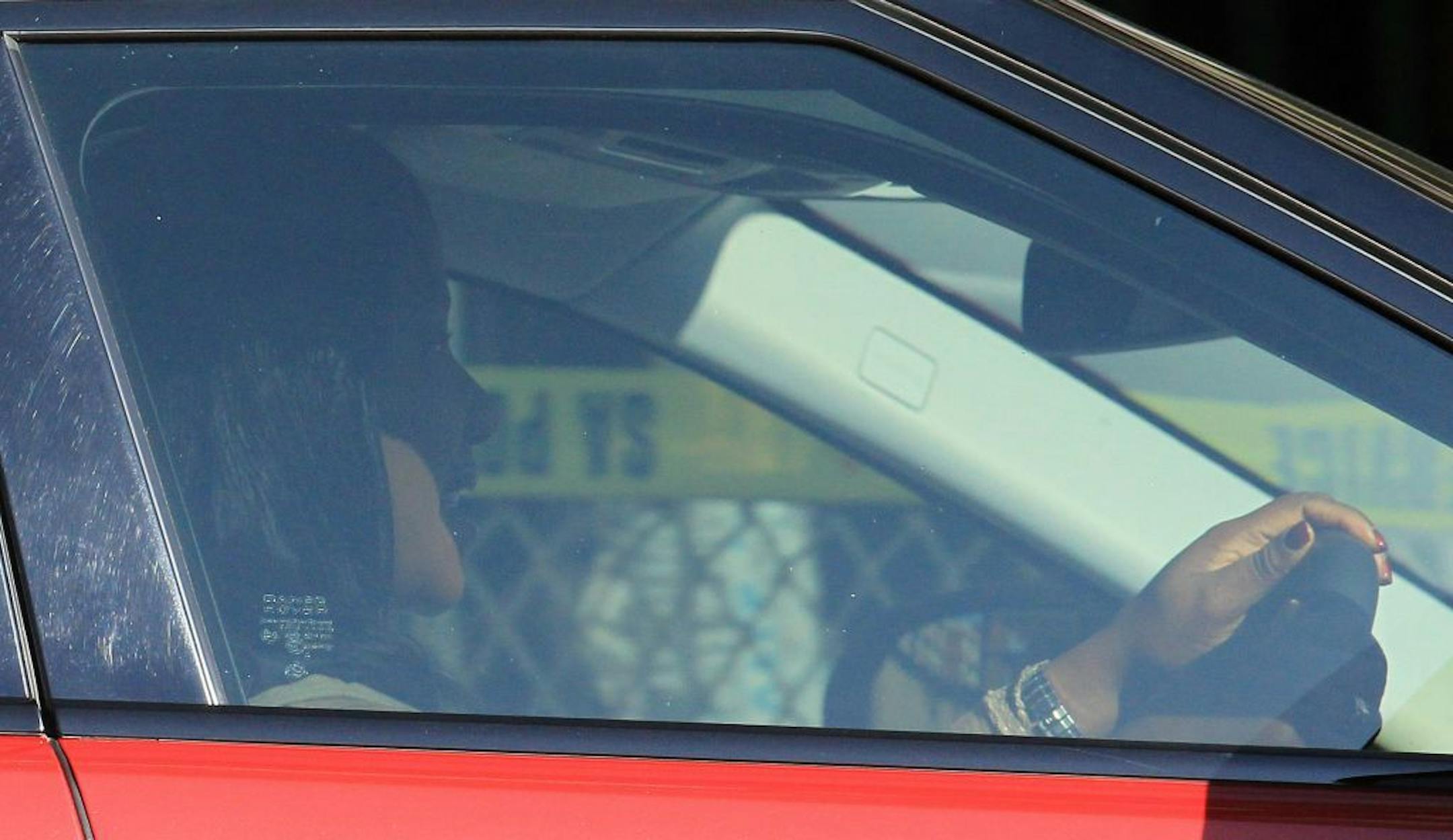 Nelson Mandela's daughter Makaziwe Mandela drives out of the hospital in Pretoria, South Africa, Tuesday, June 11, 2013, where it is believed former president Nelson Mandela is being treated for a recurring lung infection. Mandela was hospitalized Saturday with the government statement saying that Mandela remains in a serious but stable condition.