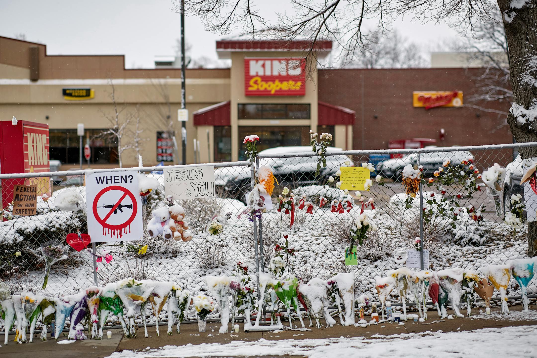 A dusting of snow coats the makeshift memorial on Wednesday, March 24, 2021, for those who lost their lives in the mass shooting at King Soopers grocery store in Boulder, Colo. The man accused of gunning down 10 people at the grocery store on Monday is scheduled to make his first court appearance on Thursday morning, according to court records. (Stephen Speranza/The New York Times)