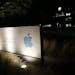 FILE - In a Friday, June 7, 2013 file photo, a sign displays the Apple logo outside of the company's headquarters in Cupertino, Calif. A federal judge