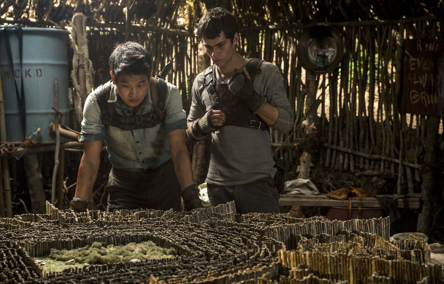 THE MAZE RUNNER Minho (Ki Hong Lee, left) and Thomas (Dylan O'Brien, right) devise an escape plan. Ph: Ben Rothstein TM and &#xac;&#xa9; 2014 Twentieth Century Fox Film Corporation. &#xac;&#x2020;All Rights Reserved. &#xac;&#x2020;Not for sale or duplication.