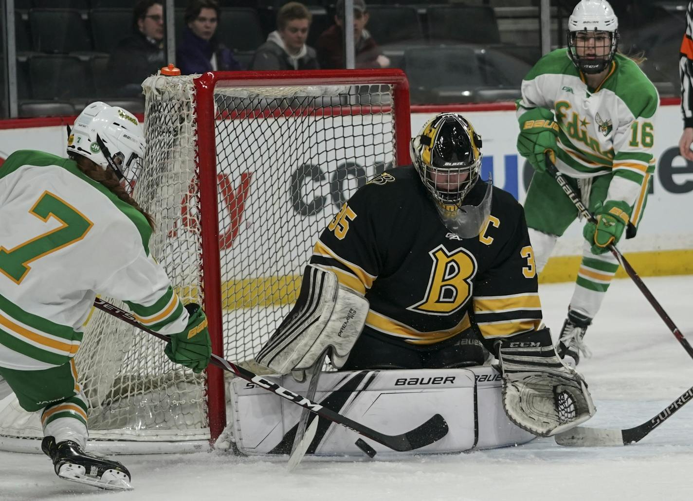 Edina High School defenseman Lily Hendrikson (7) tried to get the puck past Burnsville High School goaltender Maria Widen (35) in the second period.