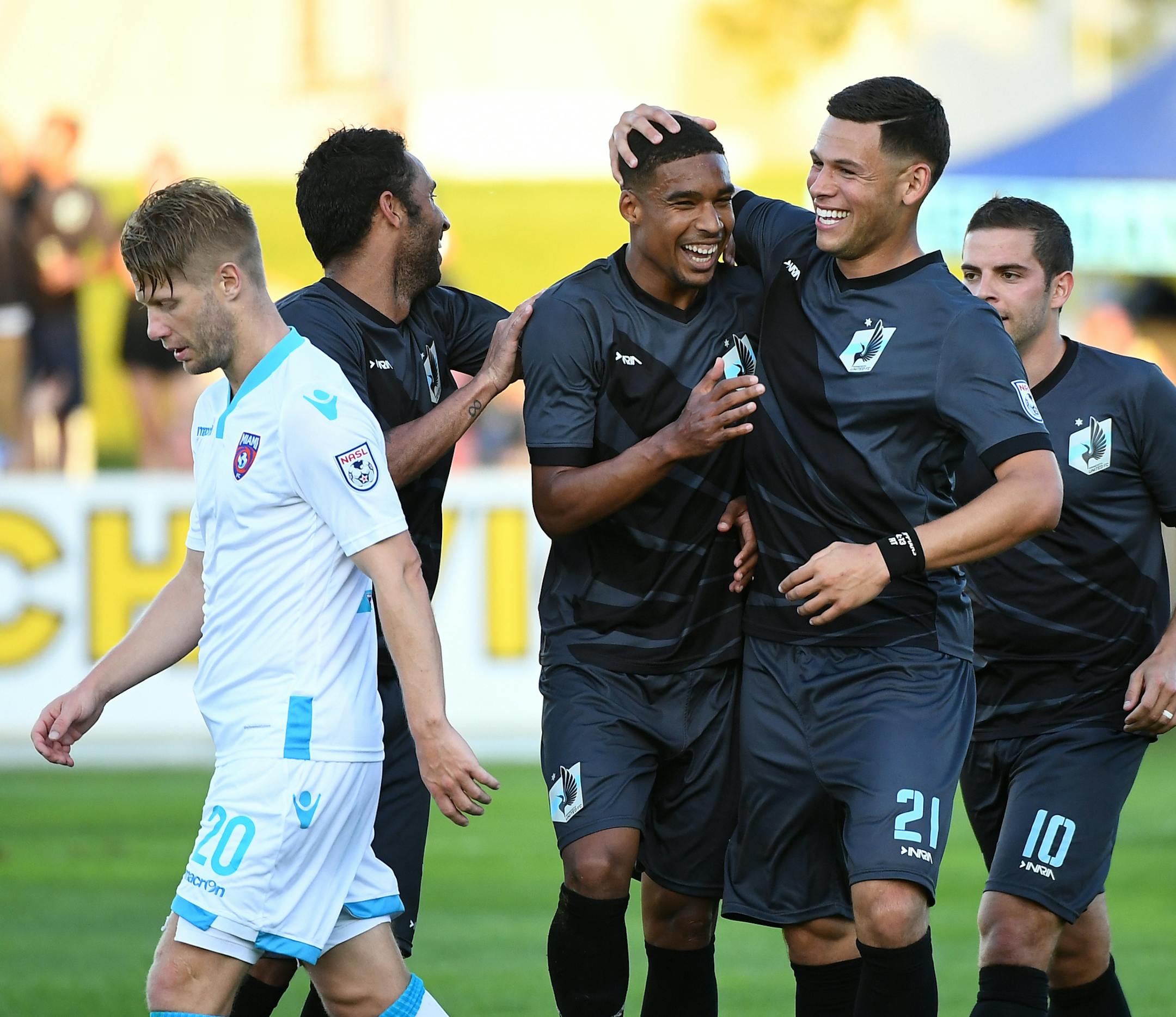 Miami FC midfielder Richie Ryan (20) was dejected as Minnesota United FC players including midfielder Ibson (7), forward Stefano Pinho (11), forward Christian Ramirez (21) and forward Ben Speas (10) celebrated a goal by Pinho in the second half Saturday. ] (AARON LAVINSKY/STAR TRIBUNE) aaron.lavinsky@startribune.com Minnesota United F.C. played Miami F.C. on Saturday, June 11, 2016 at the National Sports Center in Blaine, Minn.