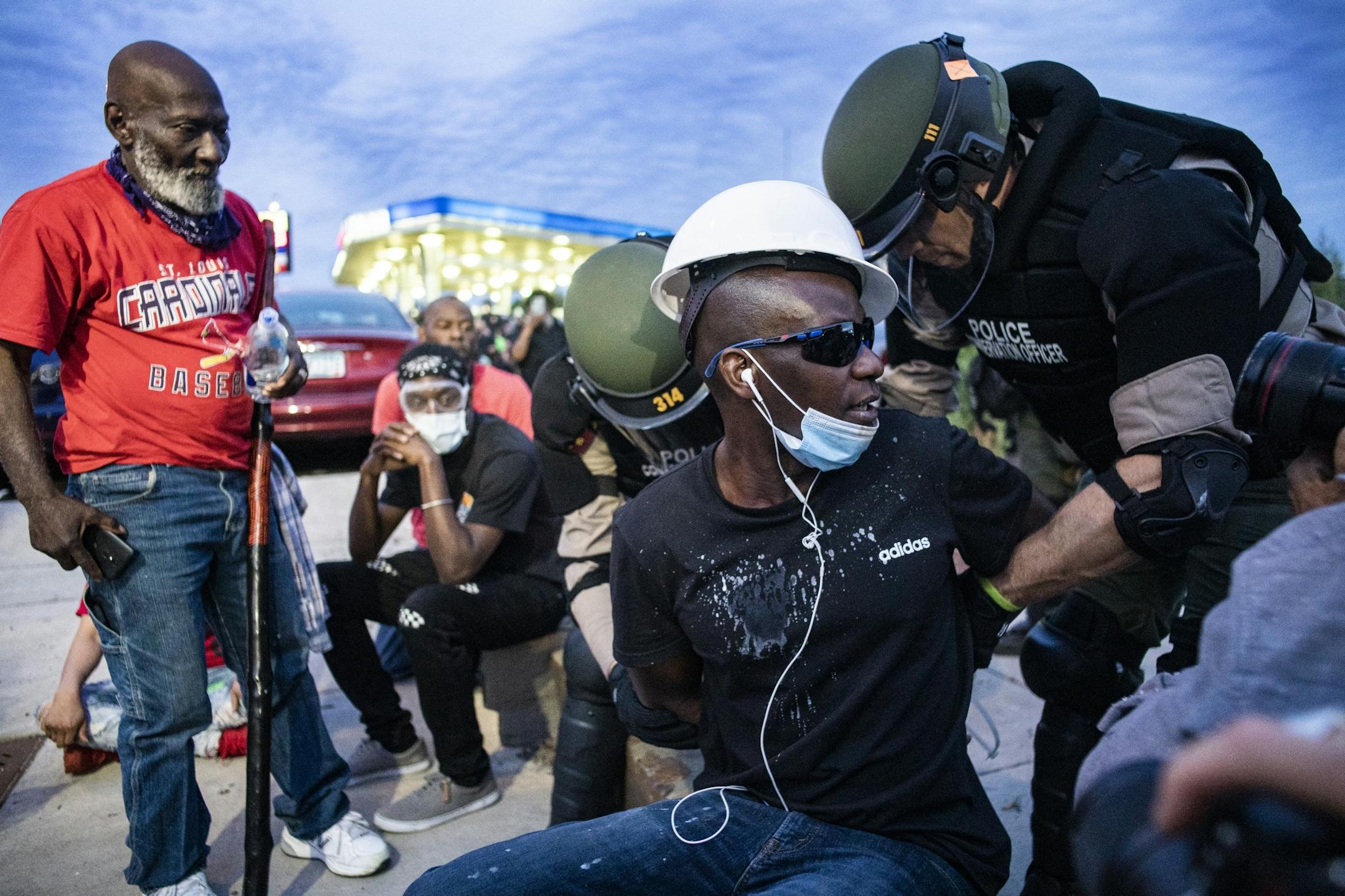 Police arrested about 150 protesters at gas station near Washington and 35W.