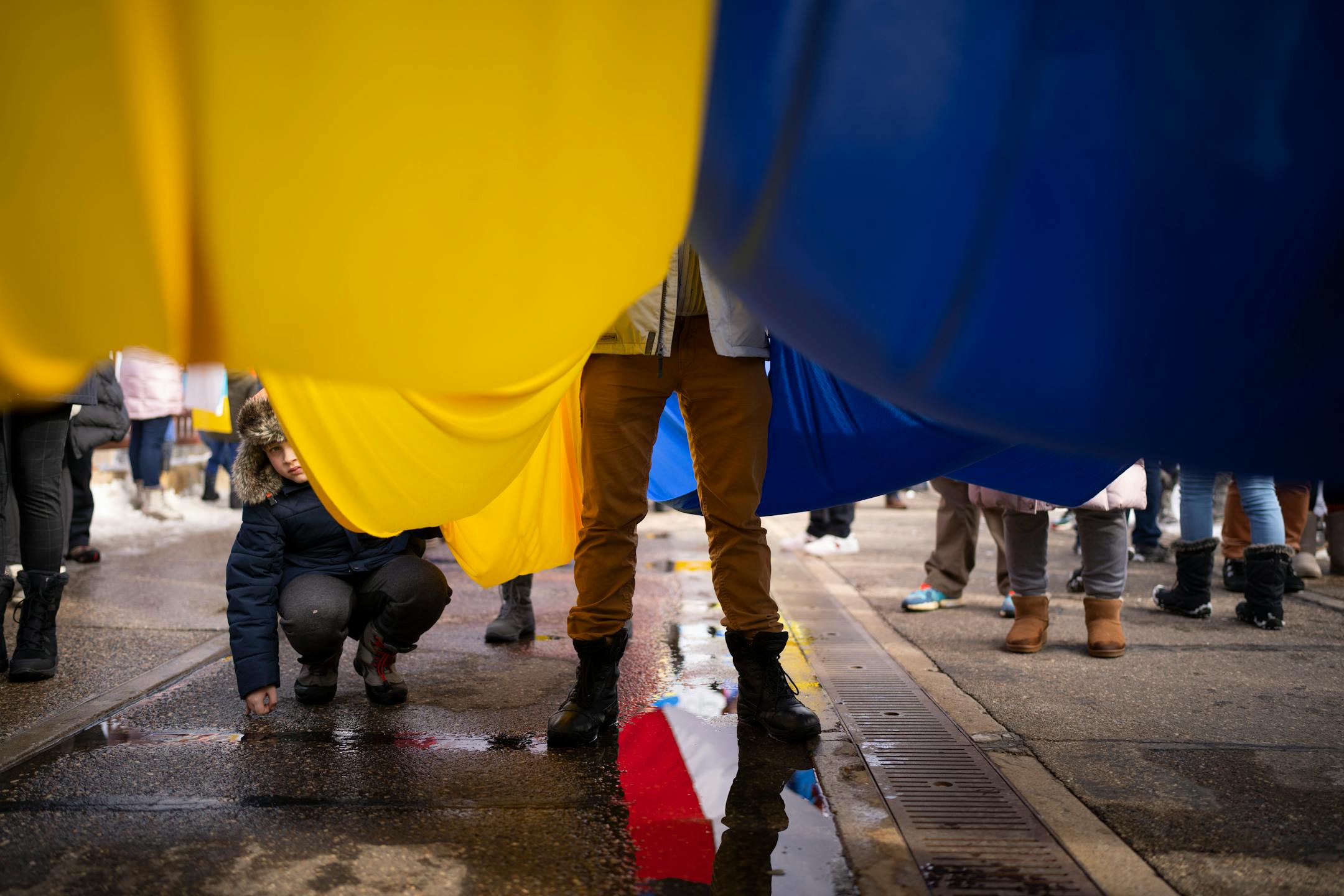 Ukraine supporters paused midway across the Stone Arch Bridge to meet with a delegation of Belarusians in a united show of support for Ukraine Sunday afternoon, February 27, 2022 in Minneapolis, Minn. Hundreds of supporters of the people of Ukraine met a few dozen supporters of the Belarusian people midway across the Stone Arch Bridge in Minneapolis before continuing on a march together across the Hennepin Ave. bridge to Northeast Minneapolis where the march first began. ] JEFF WHEELER • Jeff.Wheeler@startribune.com