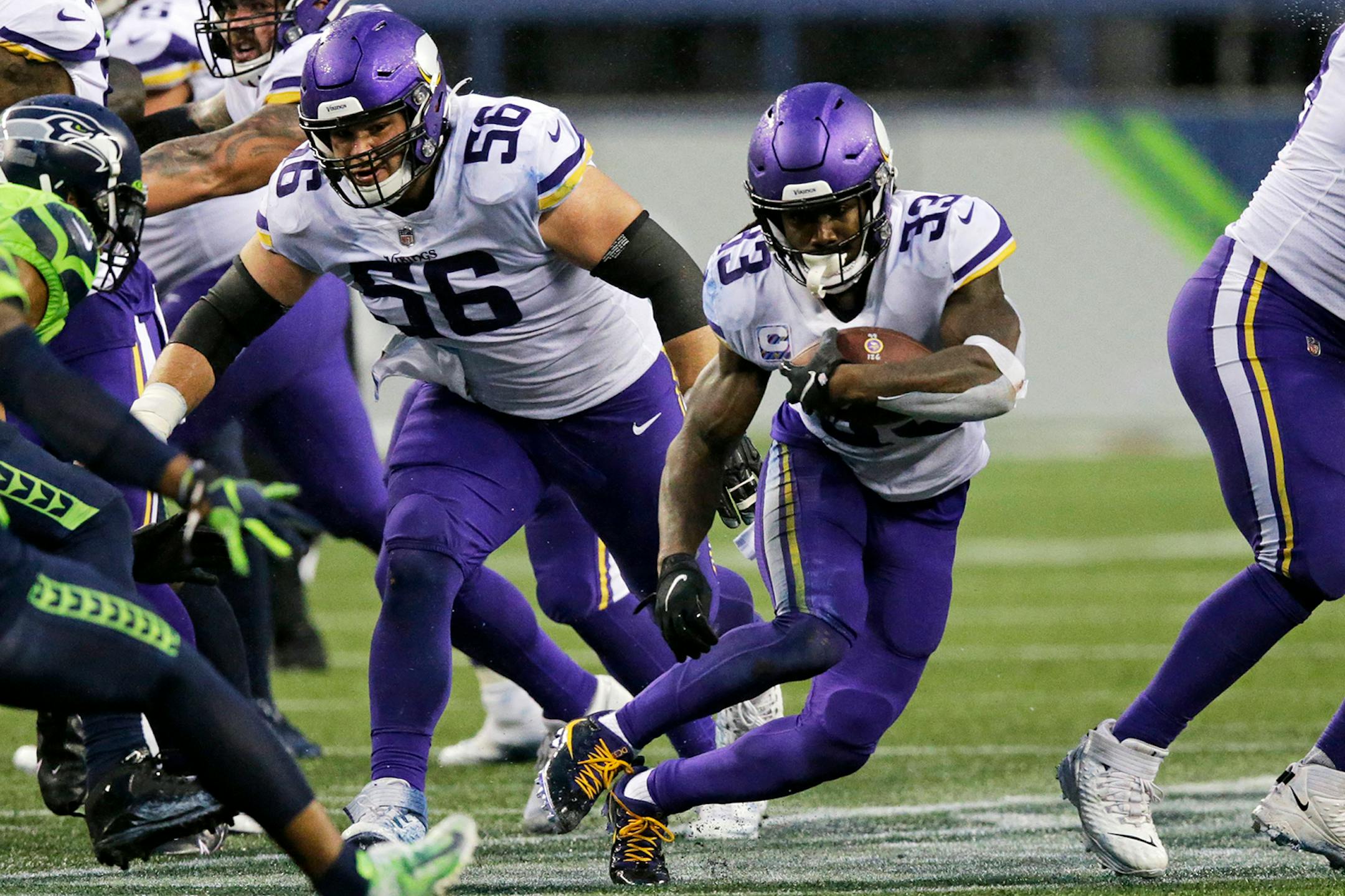 Minnesota Vikings' Dalvin Cook (33) rushes against the Seattle Seahawks during the first half of an NFL football game, Sunday, Oct. 11, 2020, in Seattle. (AP Photo/John Froschauer)