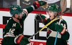 Mikael Granlund (64) celebrated with Eric Staal (12).