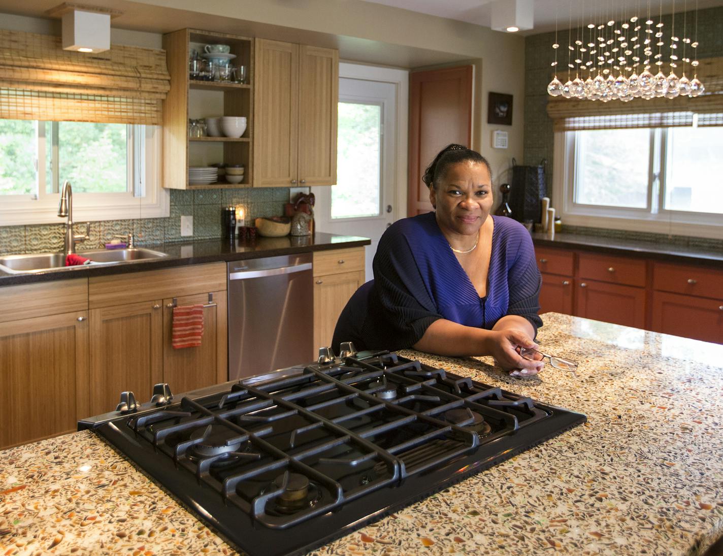 Jevetta Steele poses for a portrait inside her renovated kitchen.