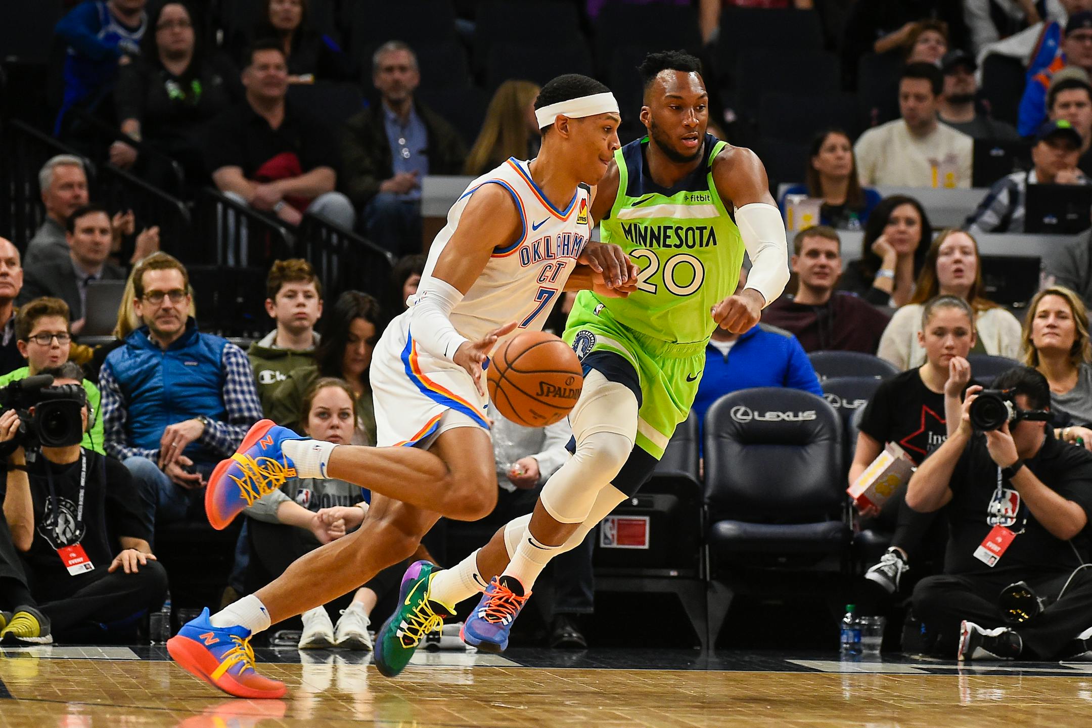Oklahoma City forward Darius Bazley drives past Timberwolves guard Josh Okogie during the first half