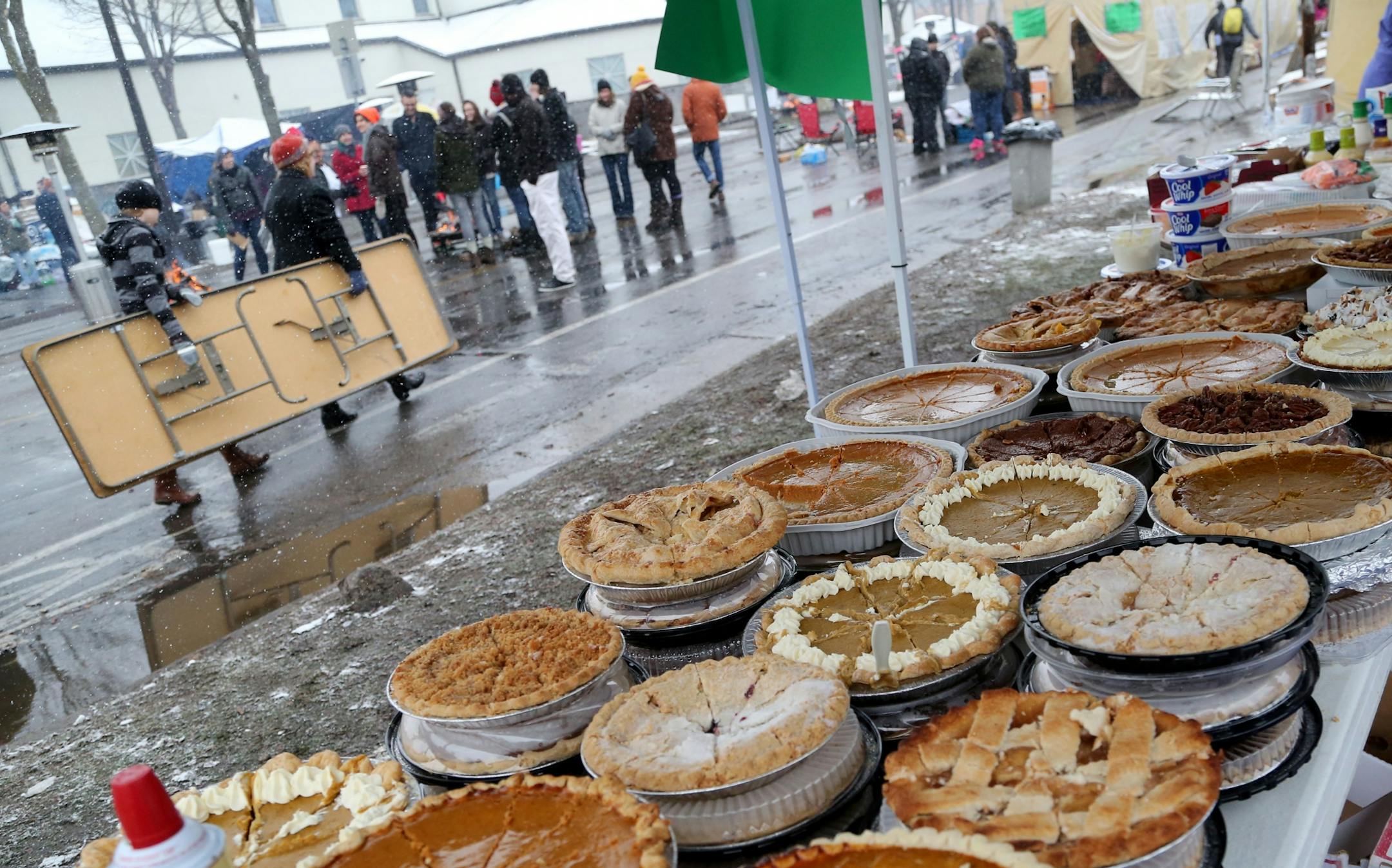 BlacksGiving event on Thanksgiving outside the Minneapolis Police Department�s 4th precinct Thursday, Nov. 26, 2015, in Minneapolis. Here, a table is overflowing with desserts for the BlacksGiving event.