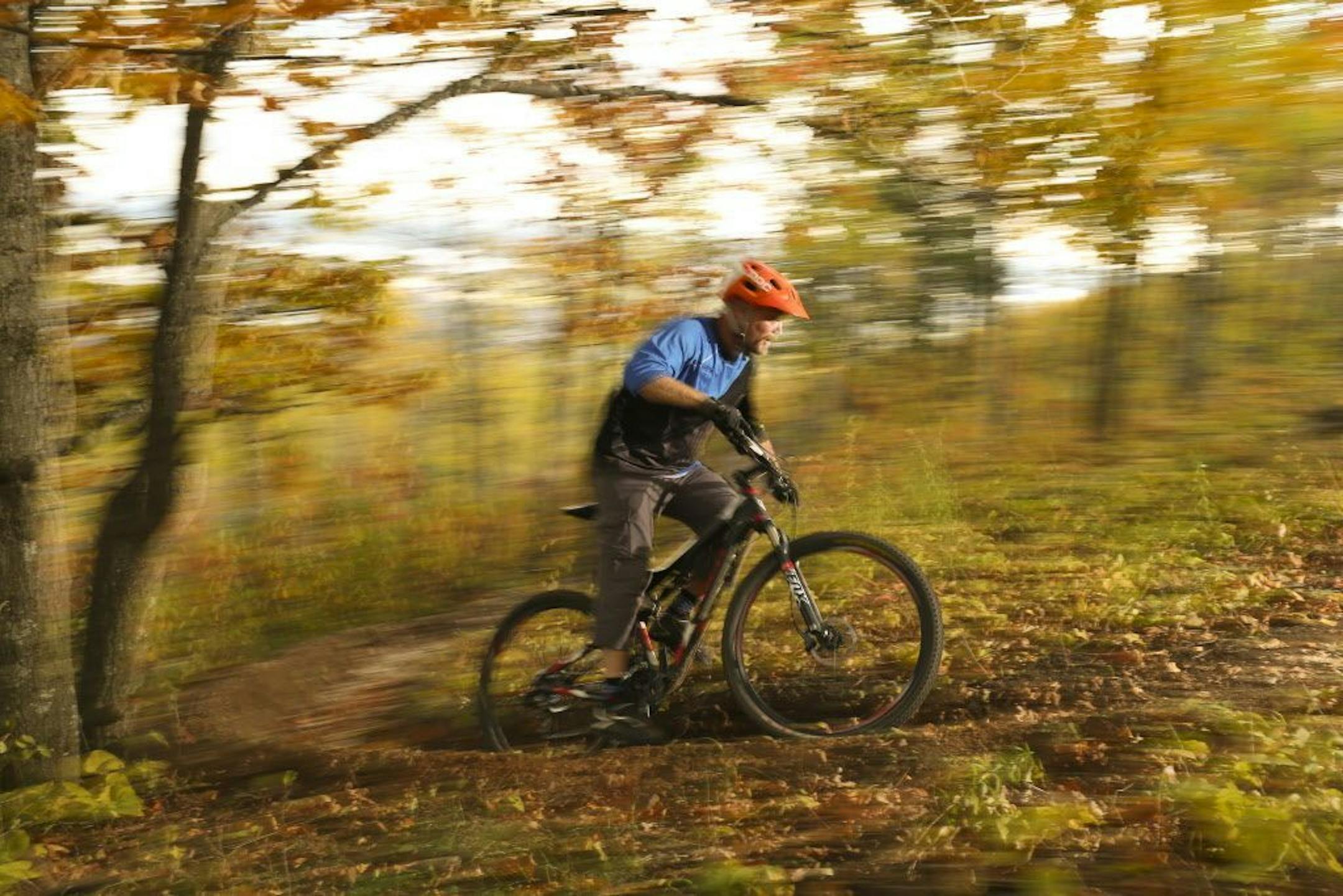 Hansi Johnson riding on a newly opened mountain bike trail, "Kissing Booth" above Duluth.