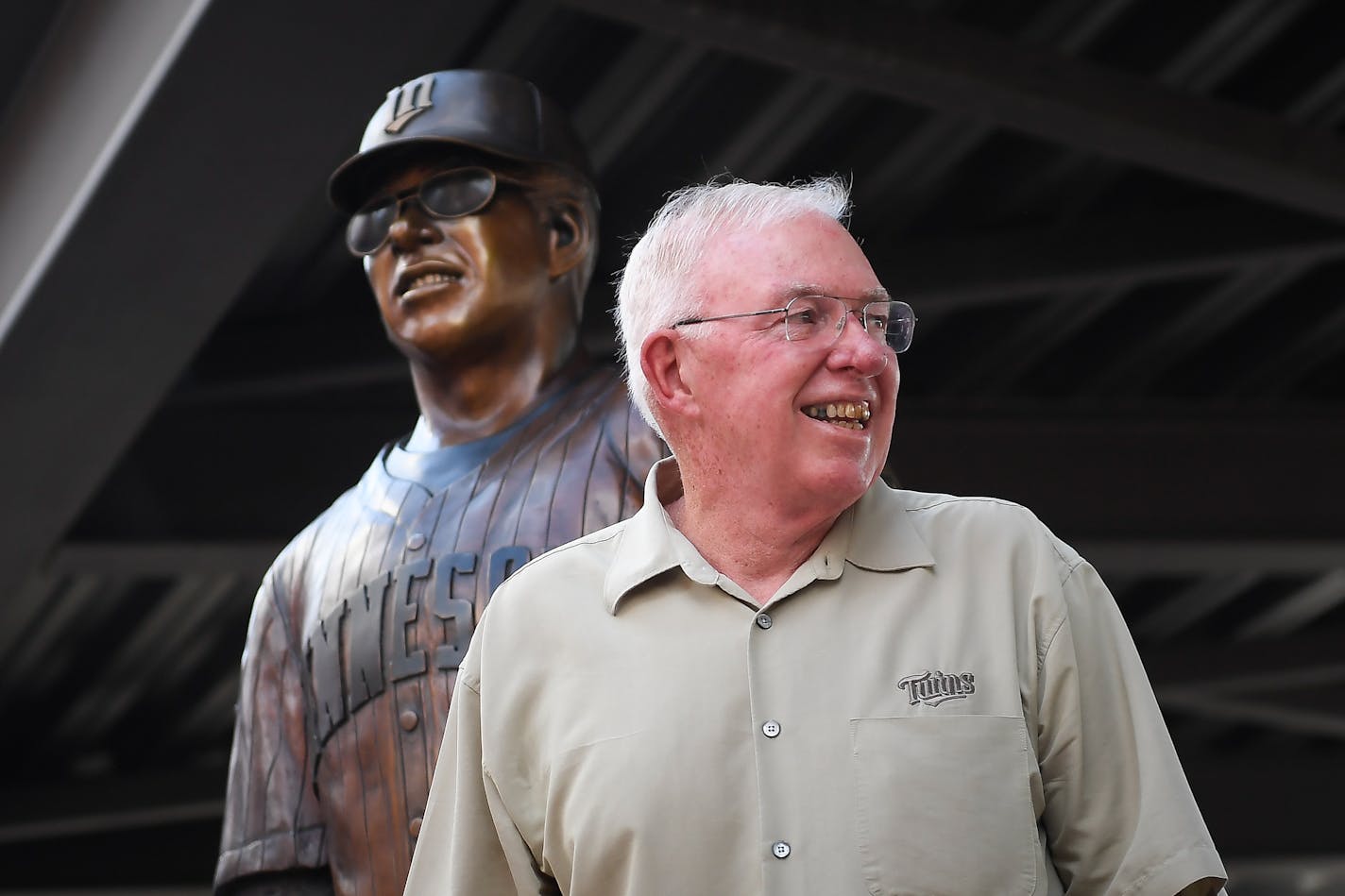 Tom Kelly stood in front of his just-unveiled statue during its unveiling ceremony Friday