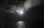 In an image provided by the U.S. Navy, the destroyer USS Porter launches a Tomahawk missile from the Mediterranean Sea on April 7, 2017. Russia on Fri