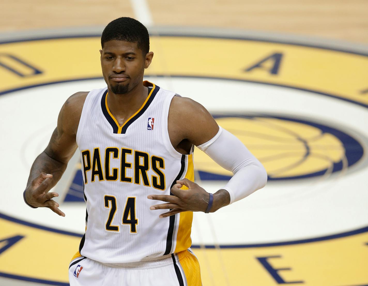 Indiana Pacers' Paul George gestures after hitting a 3-point shot during the second half of Game 5 of the Eastern Conference finals NBA basketball playoff series against the Miami Heat on Wednesday, May 28, 2014, in Indianapolis. (AP Photo/Darron Cummings)