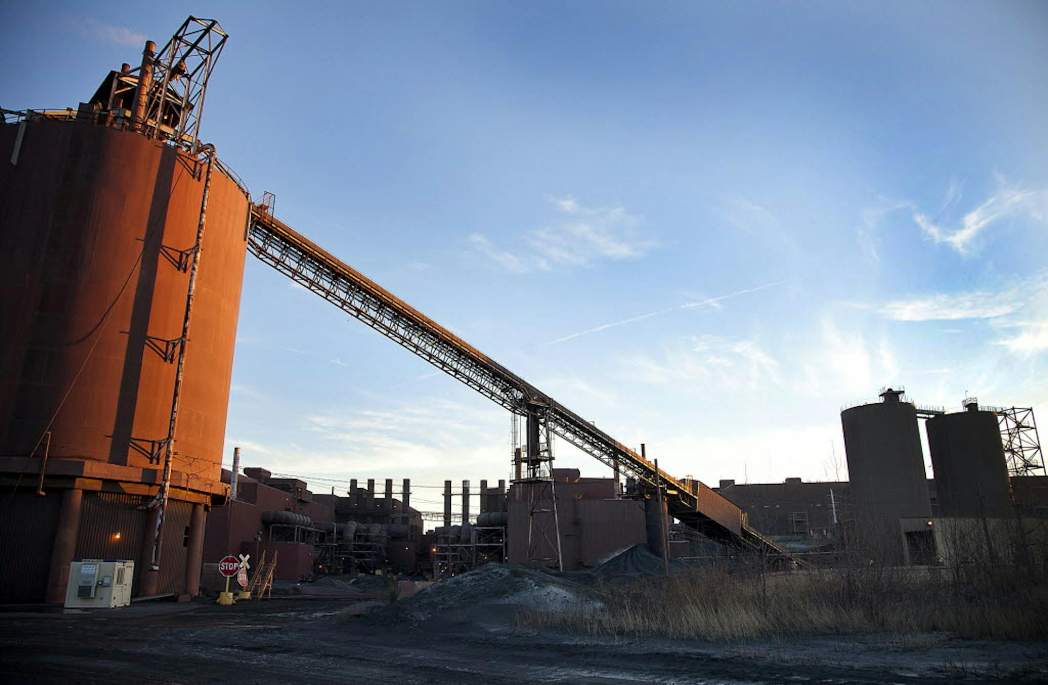 Pellet load-out bins stand at the back of the Hibbing Taconite Co. pellet manufacturing plant, operated by Cliff's Natural Resources Inc., in Hibbing.