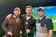 "Deadpool and Wolverine" star Hugh Jackman, center, visited an indoor golf course in Rochester this week. He posed for photos with Chip Shots employee