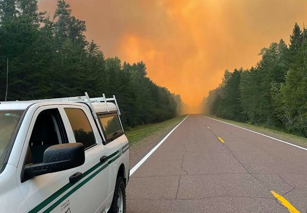 A rapidly growing wildfire in northeastern Minnesota, seen Thursday, is prompting evacuations.